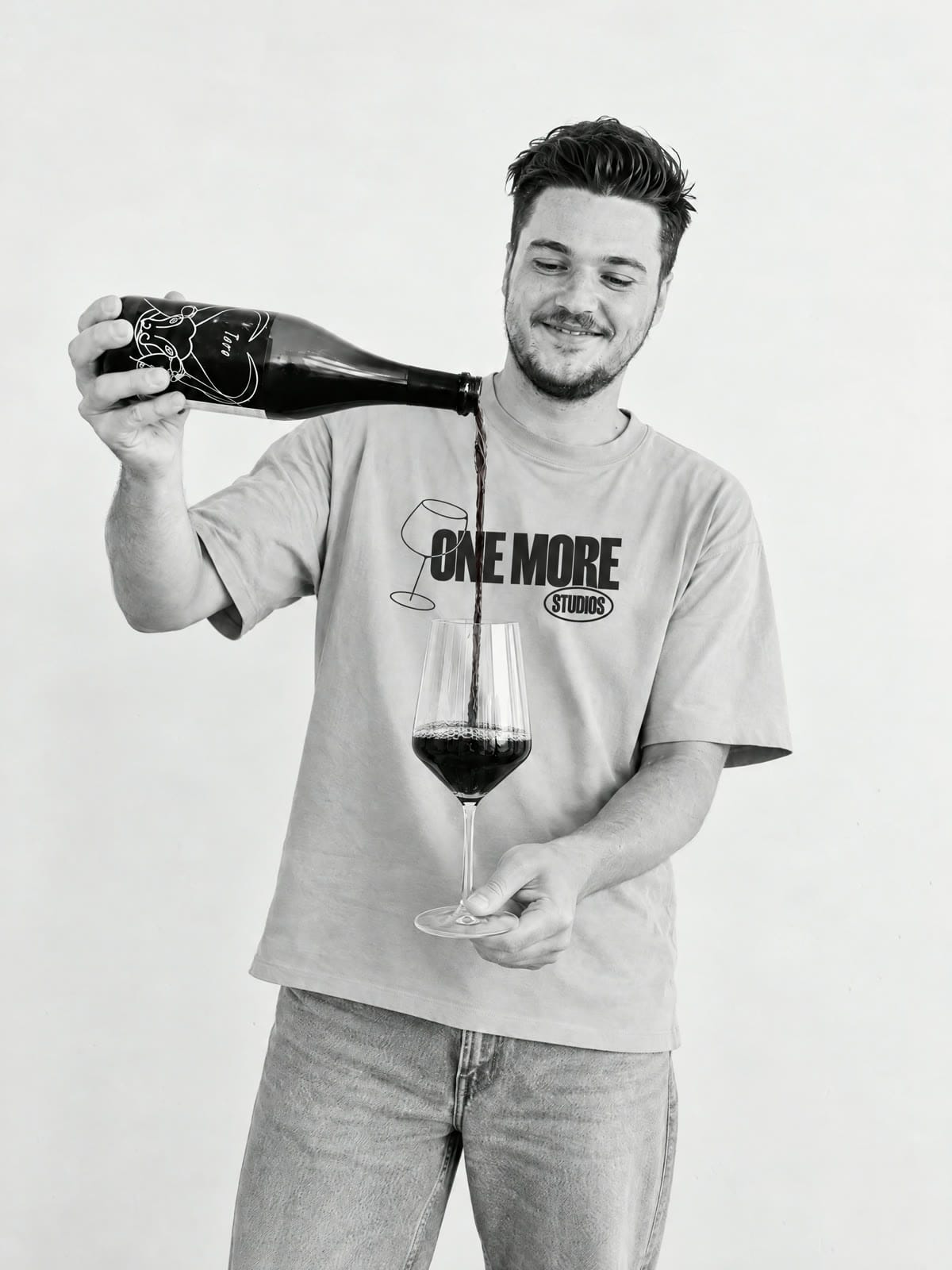 Jarrad Collings pouring a glass of red